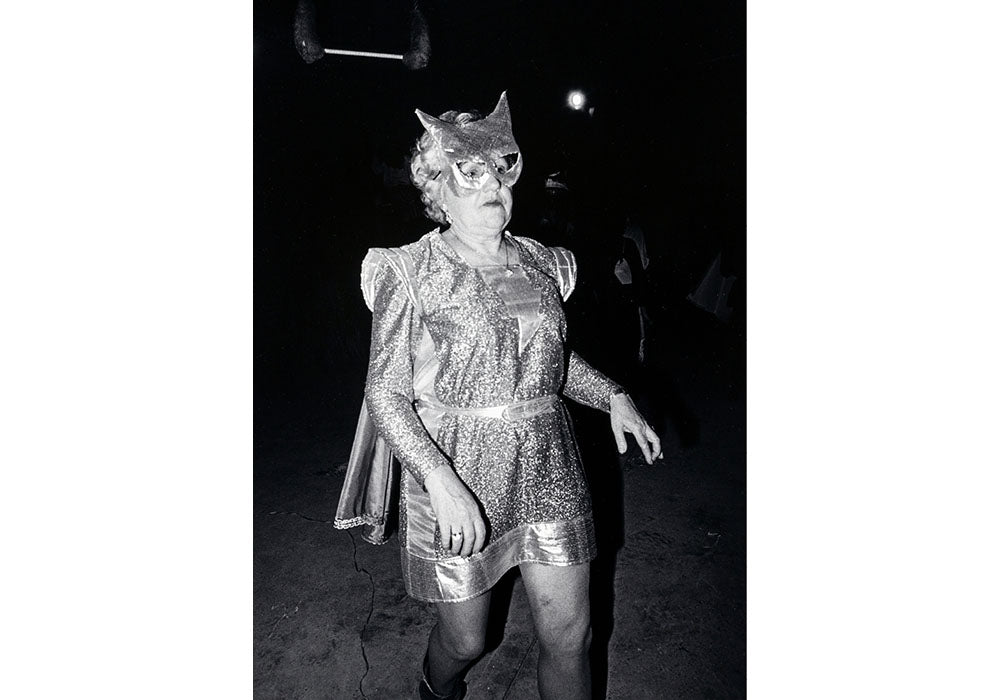 John Beggs - Untitled- Woman in a lurex batman suit.